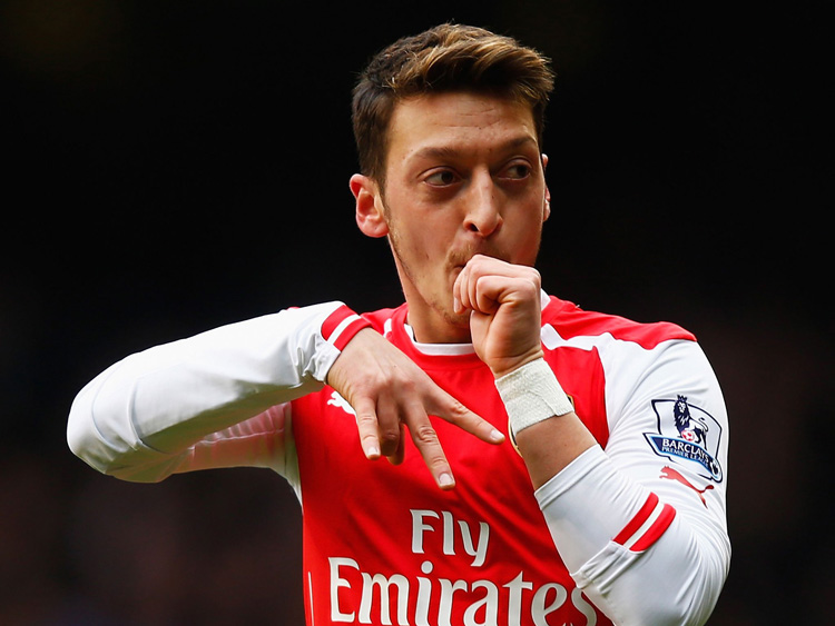 Mesut Ozil in action for Arsenal